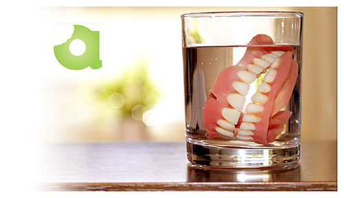 Atlas Dentures in a glass